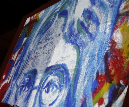 This wonderful digital projection of artwork states (in the middle of John Lennon's forehead) "the revolution will never be televised." 