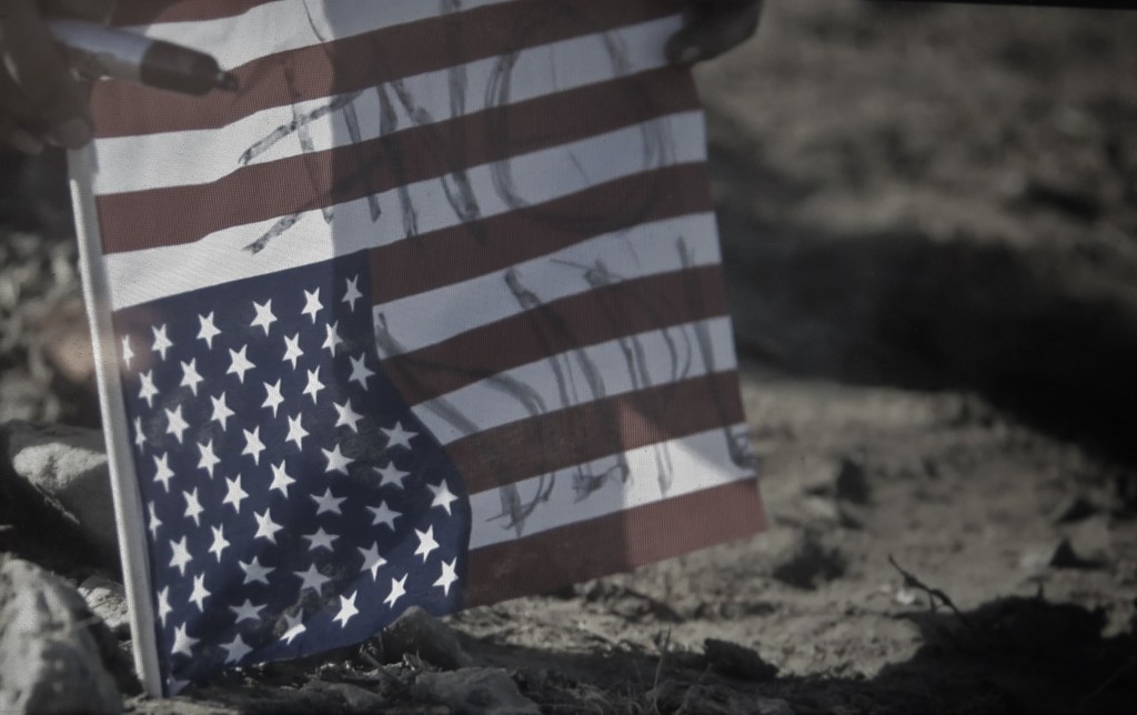 The American Flag Upside Down=Distress. 'End of The Line: The Women of Standing Rock,' Shannon Kring director, Athena Film Festival (courtesy of the film)