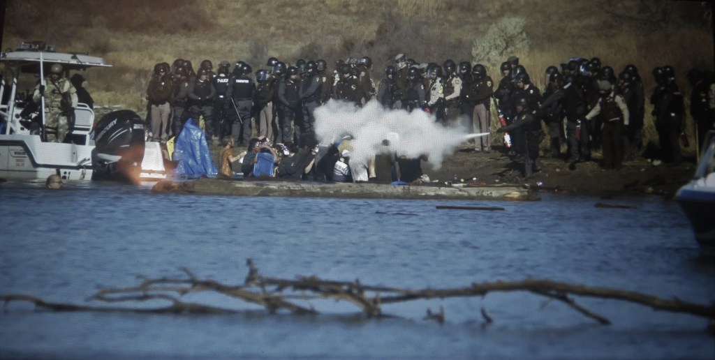 Tear gas, rubber bullets, fire extinguishers were used against unarmed water protectors. 'End of The Line: The Women of Standing Rock,' (courtesy of the film)