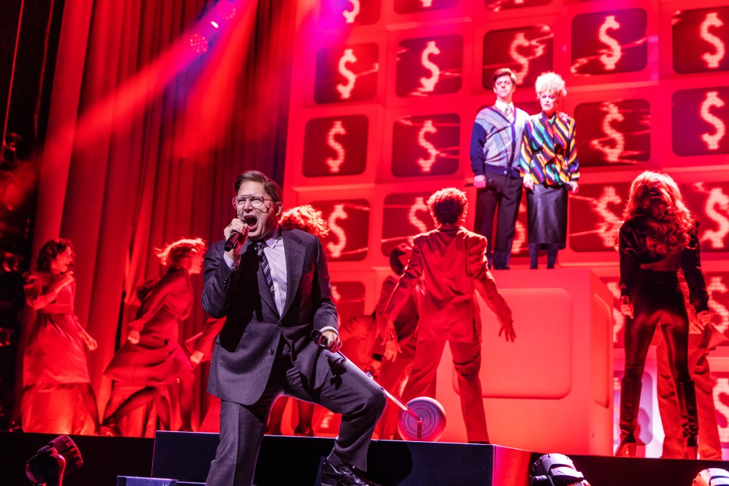 (Foreground) Michael Cerveris and cast, (background) Christian Borle, Katie Brayben in 'Tammy Faye' (Matthew Murphy)