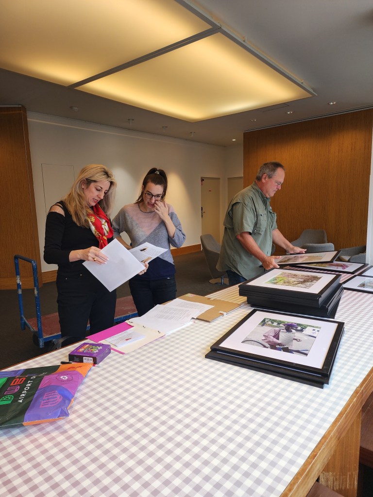 Rory with the exhibition team setting up the photos (Carole DI Tosti)