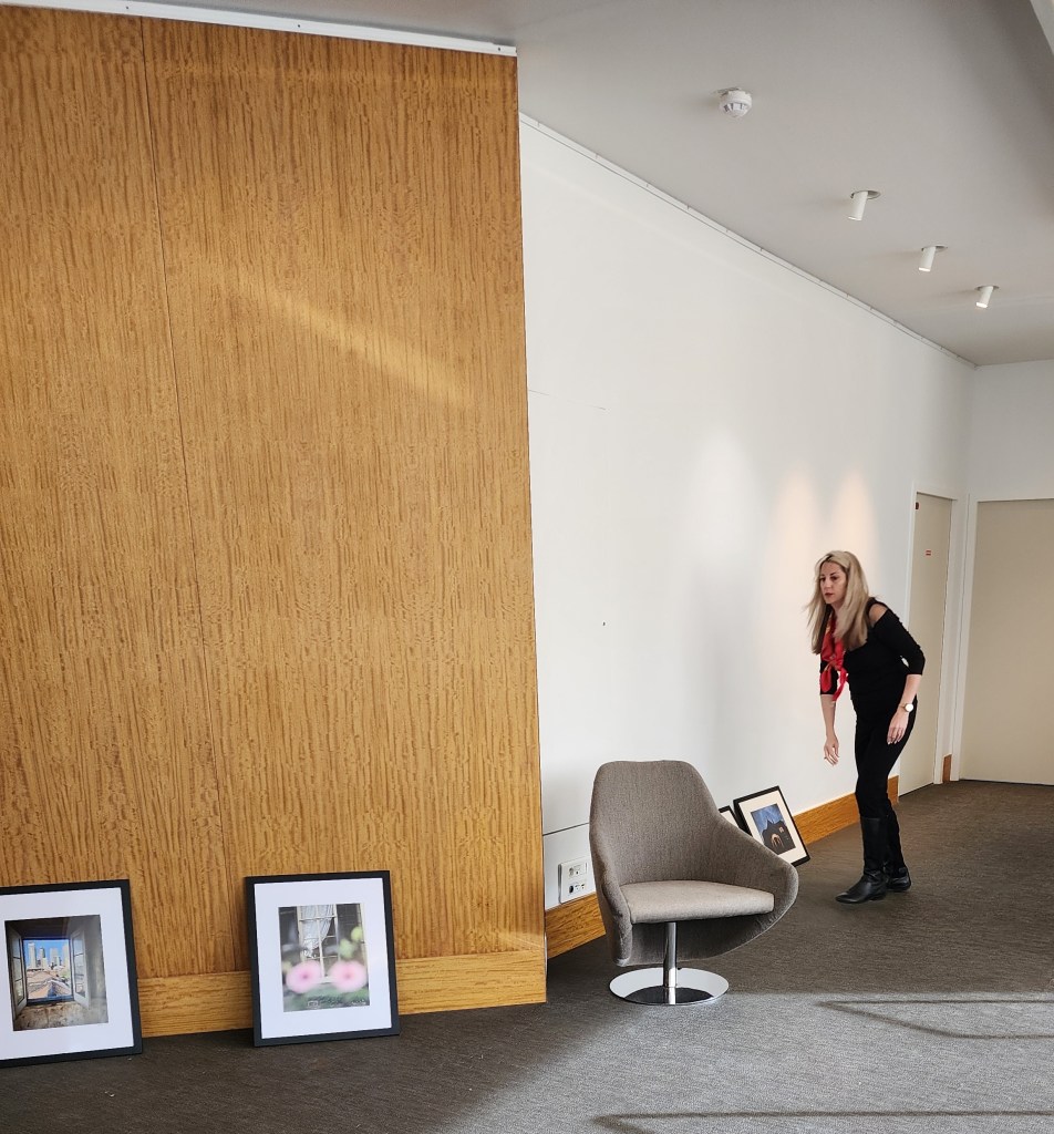 Here, Rory is selecting and arranging photographs for the exhibition at FIAP 'Piercing the Veil.' The photographs appear in The Haunted Guide to New Orleans. (Carole Di Tosti)