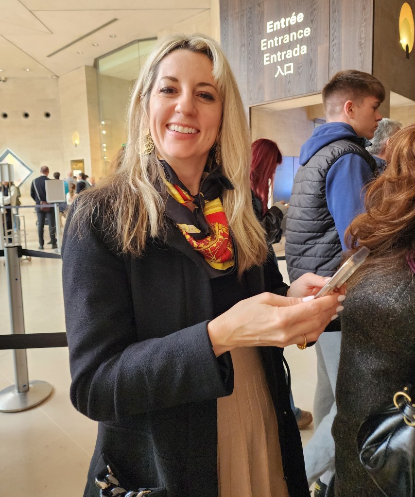 We had a timed ticket for the David exhibit, but we still had to wait. Rory checking out information (Carole Di Tosti)