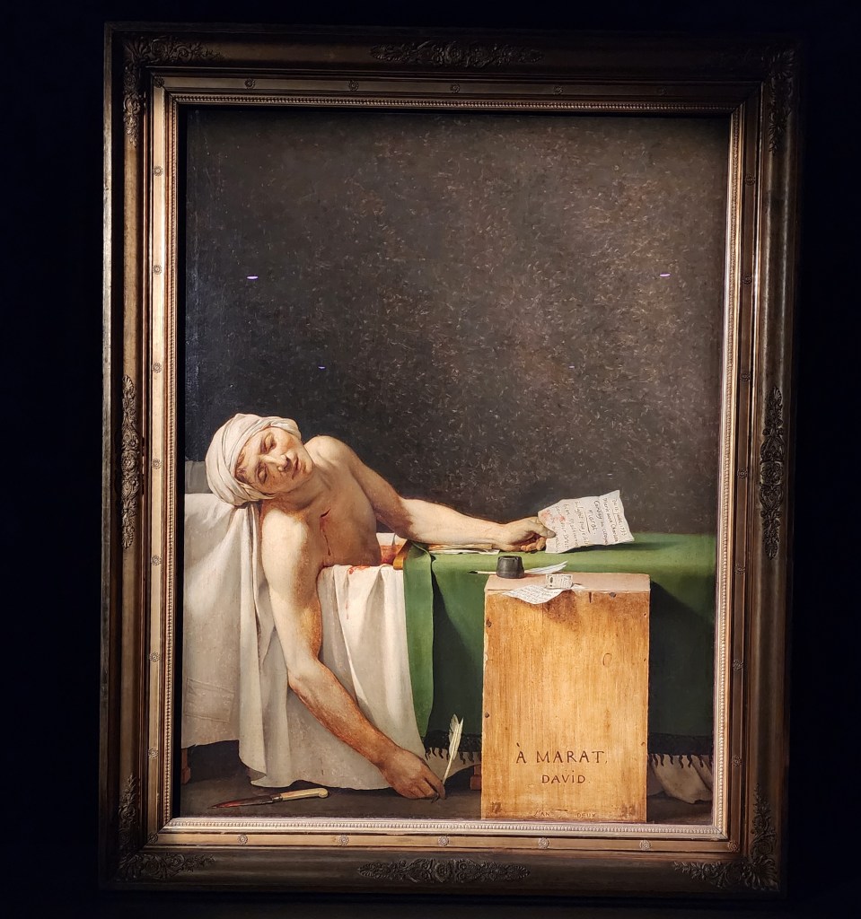 The Death of Marat (1793) by Jacques-Louis David. David shows his friend, the French revolutionary leader, Jean-Paul Marat, after being murdered in his bath by Charlotte Corday. It was a controversial painting, the Louvre exhibit of Jacques-Louis David's works. (Carole Di Tosti)