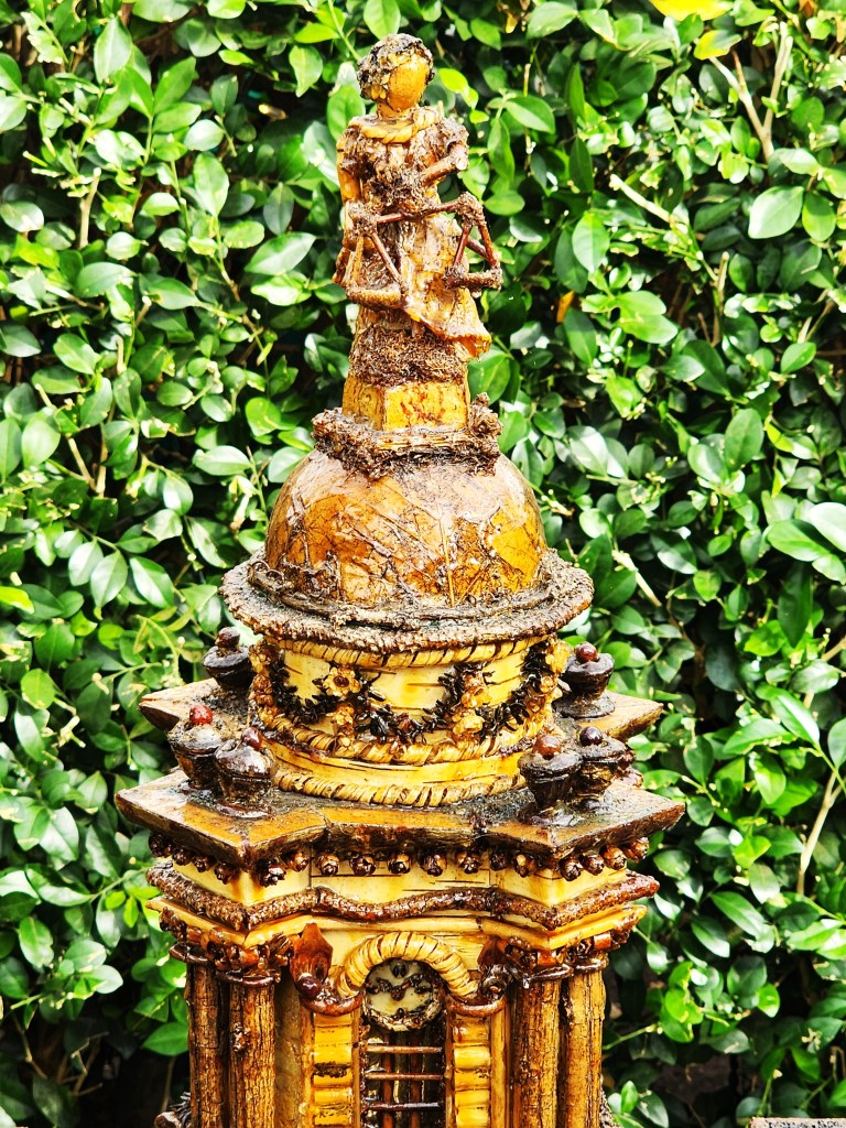 Look for the plant parts that constructed the top part of the building. NYBG Holiday Train Show® (Carole Di Tosti) 