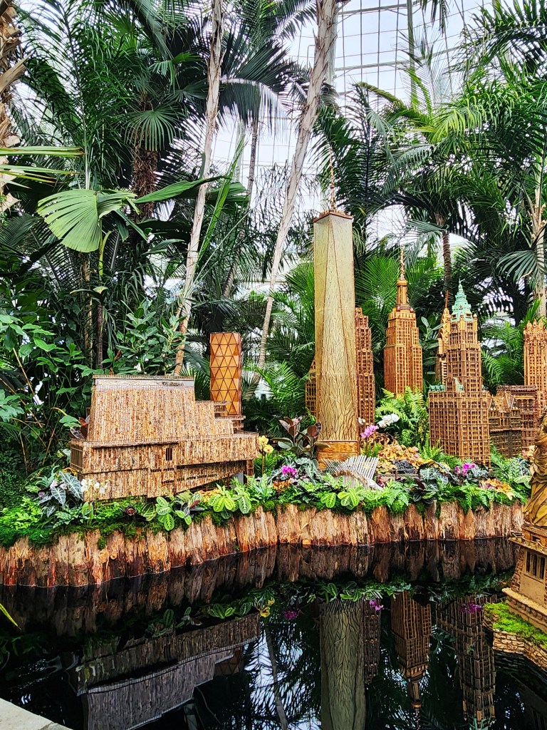On the far left is a replica of the Whitney Museum, Palms of the World Gallery NYBG Holiday Train Show® (Carole Di Tosti)