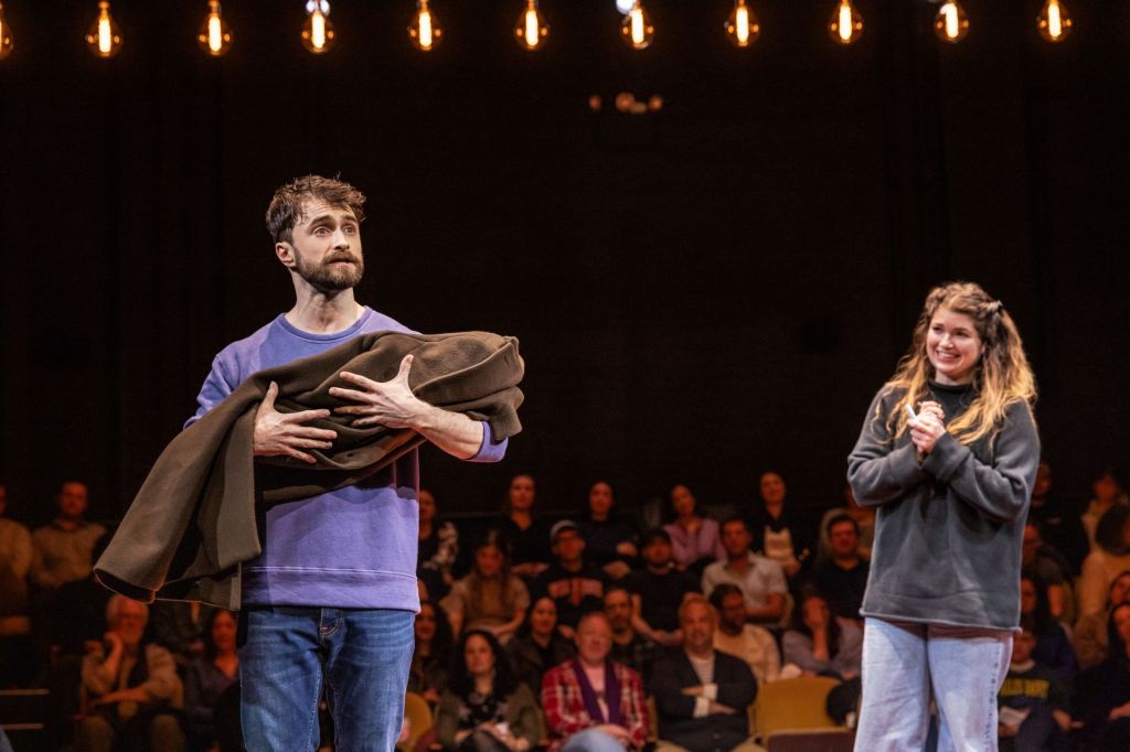 Daniel Radcliffe in 'Every Brilliant Thing' with an audience member portraying "the vet" (Matthew Murphy) 