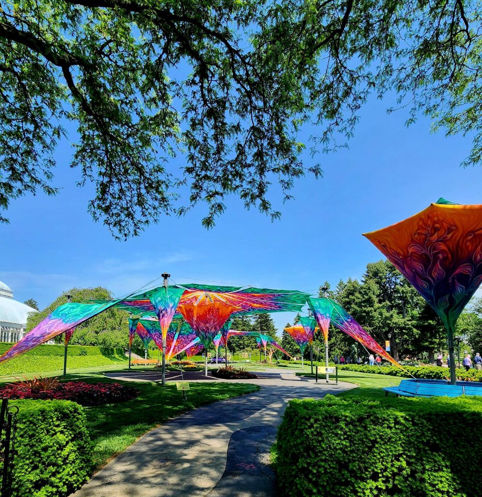 Hand painted tapestry installation on the great lawn in front of the Enid A. Haupt Conservatory at NYBG (Carole Di Tosti)