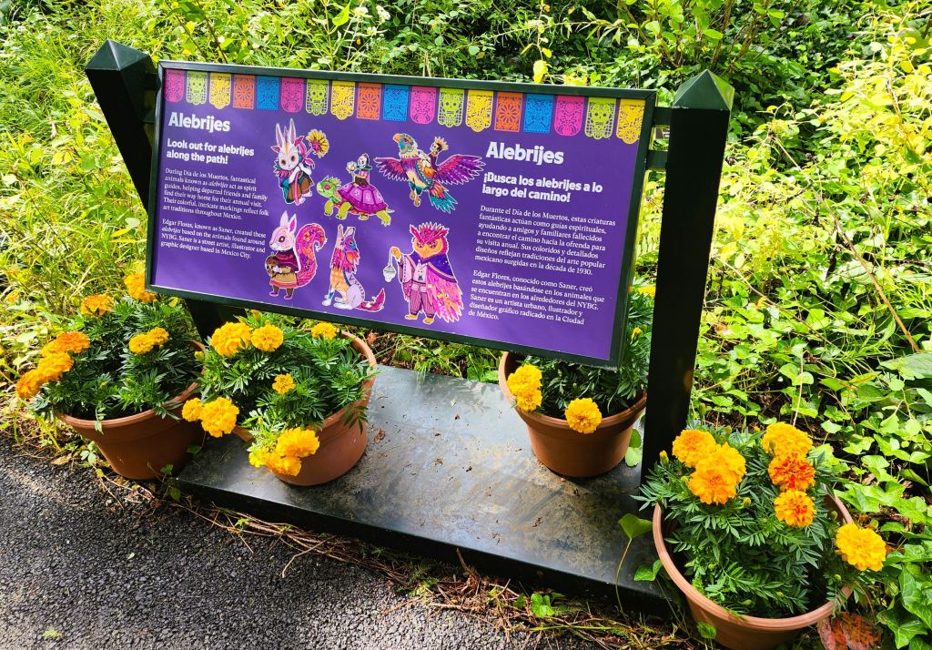Alebrjes are friendly spirit guide animals based on wildlife found at NYBG, 'Dia de los Muertos,' Everett Children's Garden. Signage identifies the animals that lead visitors on the journey (Carole Di Tosti)
