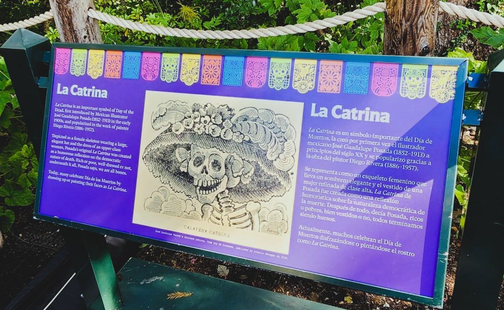 The Signage explains the significance of La Catrina, a satire created by Mexican printmaker, José Guadalupe Posada. 'Dia de Los Muertos,' NYBG Everett Children's Adventure Garden (Carole Di Tosti)